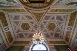 decorated ceiling and chandelier in the dining room of the eighteenth-century villa in Veneto